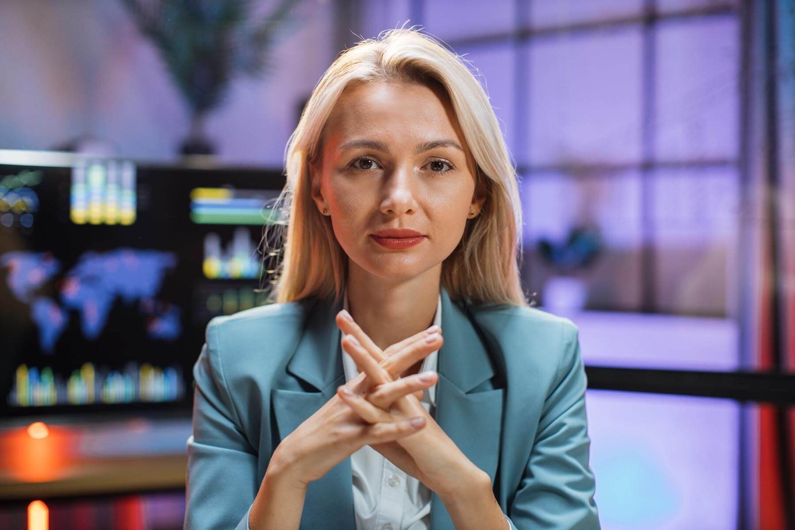 business-woman-sitting-at-office-desk-with-papers-2021-12-09-04-45-41-utc.jpg